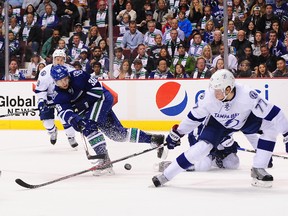 Tampa Bay Lightning defenceman Victor Hedman, right, suffered a broken finger while blocking a shot Saturday while playing against the Canucks. (USA TODAY)