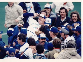 The Blue Jays celebrate, carrying starting pitcher Doyle Alexander off the field after he beat the New York Yankees to help the Jays clinch their first post-season birth in their history back in 1985. The smiles were shortlived, however, as the Royals — and George Brett — pounded Alexander in the ALCS. Brett’s three homers were all hit off of the Jays pitcher. (TORONTO SUN/FILES)