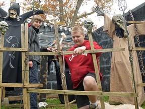 Kyle Oosting (right) and Eric Ward 'mend' a lattice fence during setup for the annual McCarey Haunted House at 6 Third Concession Road (between Mall Road and Simcoe Street). Opening night is Thursday, Oct. 23, 7-9 p.m. The Haunted House will be open 7-9 each night until Halloween (5-9 p.m.). Admission is a donation for the local food bank.