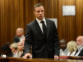 South African Olympic and Paralympic track star Oscar Pistorius attends his sentencing at the North Gauteng High Court in Pretoria on October 21, 2014. (REUTERS/Herman Verwey/Pool)