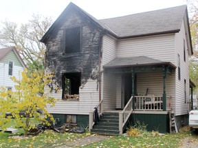 Police, firefighters and Ontario's Fire Marshal were on scene Tuesday at 132 Alfred St., where a house was damaged by fire in the early morning. One man was taken to hospital with serious injuries. (TYLER KULA, The Observer)
