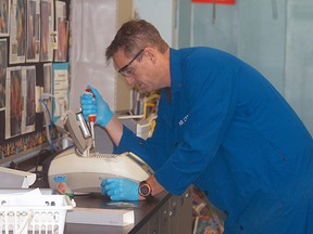 Wallaceburg District Secondary School science teacher Brent Campbell works on a project in a science class. Campbell was recently named the winner of the Irwin Talesnick Award for Excellence in the Teaching of Science. The award is given out by the Science Teachers Association of Ontario. (DAVID GOUGH, QMI Agency)