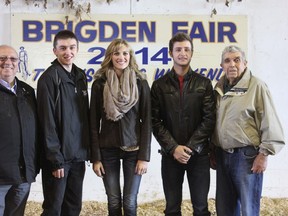 Three Lambton County post-secondary students were each presented with an IPM’ 91 scholarship worth $1,000. The scholarships are presentation annually and are made each year at the Brigden Fall Fair. From left is Sarnia-Lambton MPP Bob Bailey, scholarship recipients Duncan Annette, Ashley Cornelissen, Mitch Steven and IPM Scholarship committee chairman Bill Bilton.