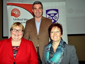 Andrew Lockie, CEO of United Way London and Middlesex (middle) is flanked by Western University’s Margaret Steele (left) and Peggy Wakabayashi, co-chairs of Western’s 2014 United Way Campaign, October 21, 2014. CHRIS MONTANINI\LONDONER\QMI AGENCY