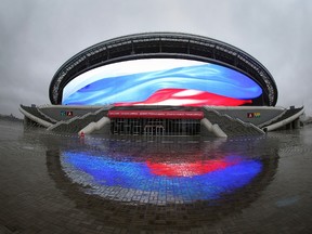 The Russian national colours are seen on a giant screen of the Kazan Arena football stadium during a visit of the FIFA inspection committee in Kazan on October 17, 2014. (AFP PHOTO / ROMAN KRUCHININ)