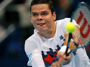 Canada's Milos Raonic returns the ball during his match against Steve Johnson of the U.S. at the Swiss Indoors ATP tennis tournament in Basel October 21, 2014. (REUTERS)