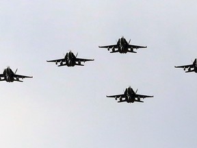 Six CF-18 Hornet fighter jets takes off from 4 Wing Cold Lake on Tuesday, October 21, 2014. The Canadian Armed Forces are providing the fighter jets to lend a hand in the fight against ISIS in Iraq. TREVOR ROBB/EDMONTON SUN/QMI AGENCY