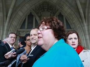 New Democratic Party (NDP) MP Libby Davies (2nd R) speaks during a news conference announcing her support for Brian Topp (C) in the NDP leadership race on Parliament Hill in Ottawa September 30, 2011. (REUTERS/Chris Wattie)