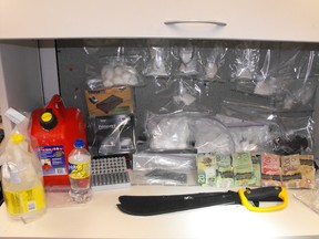 The Strathcona County RCMP Drug Unit has arrested four individuals after a two week long investigation into the trafficking of a variety of drugs in Strathcona County including Heroin, Methamphetamine, Cocaine, Crack Cocaine, GHB, Ketamine, Marihuana and counterfeit Oxycontin pills containing  Fentanyl. As a result, RCMP, assisted by Strathcona County Police Dog Services and the Edmonton Police Tactical Team, executed search warrants on October 17, 2014 at two separate residential addresses in Edmonton.  Police discovered the following suspected illegal drugs and weapons: approximately 500 grams of Soft Cocaine, approximately 80 grams of Crack Cocaine, approximately 700 grams of Methamphetamine, approximately 30 grams of Heroin, approximately 73 grams of Hash oil, approximately 311 grams of Ketamine, approximately 7200 milliliters of GHB, approximately 260 pills of counterfeit Oxycontin pills containing Fentanyl, approximately 2.5 grams of Marihuana,1 machete, assorted types of firearm ammunition, Also located and seized was approximately $12,320.00 cash and drug paraphernalia related to drug trafficking.  Tyler GRAHAM, age 26, of Edmonton was arrested