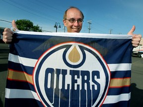 Edmonton mayor Stephen Mandel holds up an Edmonton Oilers flag on May 16, 2006 in Edmonton Alta., to help cheer on his home team. The Oilers were in the Stanley Cup Finals against the Carolina Hurricanes. The Oilers lost the dramatic and entertaining final game 7 of the series by the score of 3 to 1 in Carolina on June 19th. Edmonton Sun/QMI Agency