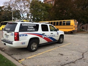 Toronto Police Emergency Task Force outside Queen's Park in Toronto Wednesday, Oct. 22, 2014 after gunfire erupted on Parliament Hill in Ottawa. School tours continued in the legislature. (Antonella Artuso/Toronto Sun)