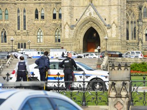 Police have locked down Parliament Hill in Ottawa on Wednesday, Oct. 22, 2014, where a shooting occurred. (MATTHEW USHERWOOD/ QMI Agency)