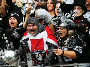 Oakland Raiders fans cheer before the start of their NFL football game against the Miami Dolphins at Wembley Stadium in London, September 28, 2014. (REUTERS)