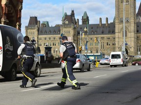 Police have locked down Parliament Hill in Ottawa on Wednesday, Oct. 22, 2014, where a shooting occurred. Matthew Usherwood/ QMI Agency