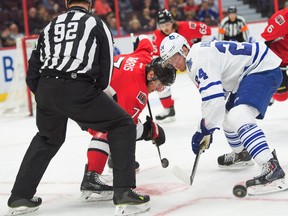 Ottawa Senators center Kyle Turris (7) and Toronto Maple Leafs center Peter Holland (24) face-off in the first period at the Canadian Tire Centre. Mandatory Credit: Marc DesRosiers-USA TODAY Sports