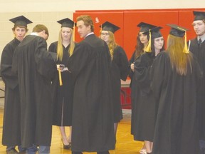 Before the commencement the graduates gathered in the gymnasium and eagerly waited for the special ceremony to begin.