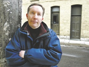 Paul Cavanagh poses in the Richmond Row area, one of the settings in the London author?s first novel, After Helen. (Free Press file photo)