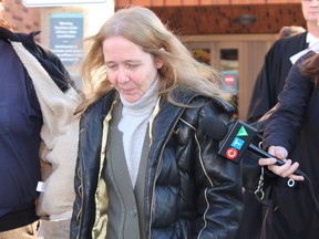 Diana Davy leaves court on Oct. 22, 2014  shortly after a jury found her and her husband, James Davy, guilty of failing to provide the necessities of life to Diana’s mother, Viola Simonds. (Tracy McLaughlin/Special to the Toronto Sun)