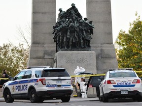 Forensic workers work the scene where Nathan Cirillo was shot and killed at the National War Memorial on Wednesday, Oct. 22, 2014. 
Matthew Usherwood/ QMI Agency