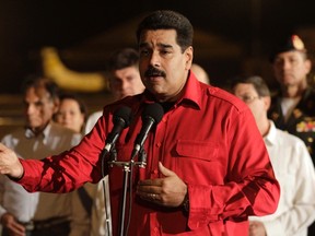 Venezuela's President Nicolas Maduro talks to the media at Havana's Jose Marti Airport, October 19, 2014. (REUTERS/Stringer)