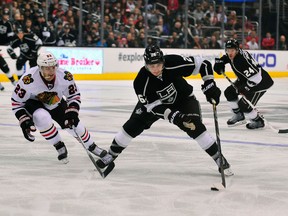 L.A. Kings defenceman Slava Voynov (right) has been suspended indefinitely by the NHL for domestic abuse charges. (USA TODAY Sports)