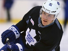 Jake Gardiner shoots the puck during Leafs practice at the Mastercard Centre in Toronto on Thursday October 23, 2014. Dave Abel/Toronto Sun/QMI Agency