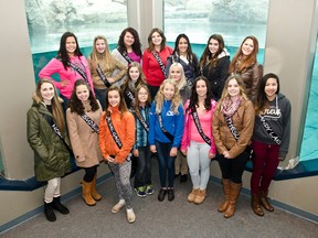 he participates of the Miss Teen Northern Ontario and Miss Jr. Teen Northern Ontario take a moment to pose for a picture during their tour of the Cochrane Polar Bear Habitat on Friday