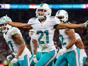 Miami Dolphins' Brent Grimes celebrates an interception against the Oakland Raiders during their NFL football game at Wembley Stadium in London, September 28, 2014. (REUTERS)