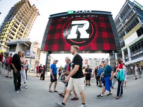 Fans take in the first home game of the Ottawa Redblacks CFL season at the newly build TD Place in Ottawa, July 18, 2014. (Chris Roussakis/Ottawa Sun/QMI Agency)