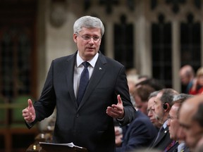 Prime Minister Stephen Harper addresses the House of Commons in Ottawa on October 23, 2014, as the government went back to work following a shooting October 22, in which a gunman killed a soldier and ran through Parliament shooting before being shot dead himself. (REUTERS/Chris Wattie)
