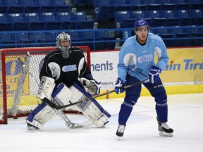 Sudbury Wolves forward Nick Baptiste sets up in front of netminder Troy Timpano during practice at Sudbury Community Arena on Thursday afternoon. Baptiste will make his season debut Friday against Peterborough.