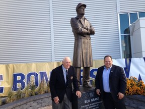 Bombers legendary coach Bud Grant and current CEO Wade Miller unveil a statue at Investors Group Field on Thursday.