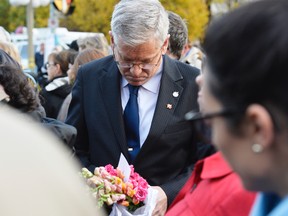 NDP MP Charlie Angus waits to lay flowers at the National War Memorial in Ottawa on Thursday, Oct. 23, 2014, where a solider was shot and killed Matthew Usherwood/ QMI Agency