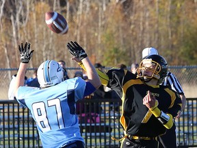 Lively Hawks quarterback Nicolas Rideout gets a pass off over St. Benedict Bears defender Tyson Kiley during high school junior boys semifinal football action at James Jerome Sports Complex on Thursday.