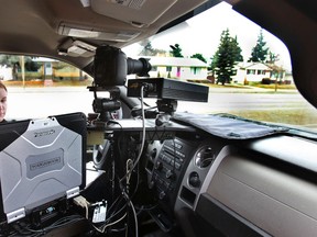 A peace officer operates a photo radar unit on 75 Street and 92 Avenue earlier this year. (Edmonton Sun file)