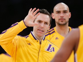 Lakers point guard Steve Nash will miss the 2014-15 season because of a recurring back injury. (USA TODAY SPORTS)