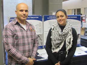 Nursing student Khaled Elmonstapha and volunteer and events coordinator Crystal Almeida of Chatham-Kent Victim Services at a volunteer fair held at Thames Campus of St. Clair College on Oct. 23.