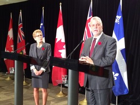 Ontario Premier Kathleen Wynne, left, and Quebec Premier Philippe Couillard at the Ontario Economic Summit in Niagara-on-the-Lake Friday. (ANTONELLA ARTUSO/Toronto Sun)