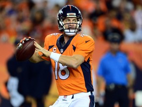 Denver Broncos quarterback Peyton Manning prepares to pass in the first quarter against the San Diego Chargers at Sports Authority Field at Mile High. (Ron Chenoy/USA TODAY Sports)