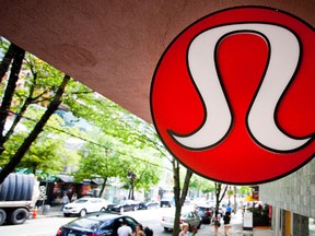 Yogawear retailer Lululemon Athletica Inc's logo is pictured at its store in downtown Vancouver in this file photo taken June 11, 2014.  Lululemon trimmed its revenue and earnings forecast for the fiscal year on Thursday, a fresh sign that the once-flying yogawear maker was still struggling to return to strong growth in an increasingly crowded field.  (REUTERS/Ben Nelms/Files)