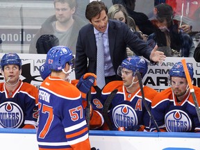 The Edmonton Oilers' head coach Dallas Eakins (top) gives instructions during third period NHL action against the Washington Capitals at Rexall Place, in Edmonton Alta., on Wednesday Oct. 22, 2014. The Oilers won 3-2. David Bloom/Edmonton Sun