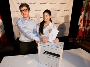As part of Elections Canada's voter education mandate to promote civic literacy among Canada's youth, Marc Mayrand  - the Chief Electoral Officer of Canada, helped to launch the student election program in parallel with the 41st general election with two GTA high school students participating in a mock election vote who later spoke about their experience with the program. (Pictured)  Zane Schwartz of Leaside H.S. and Olivia Suppa (R) of Jean de Brebuf participate in the mock election. (Jack Boland/QMI Agency)