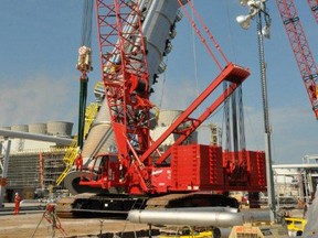 Cranes lift a tower into place at Nova Chemicals' Corunna site during the company's recent cracker revamp project. The project's joint health and safety committee won this year's John M. Back Award from the Ontario Infrastructure Health and Safety Association. SUBMITTED PHOTO