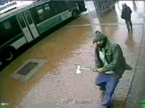 A man holding a hatchet is seen in a still image from surveillance video provided by the New York Police Department Oct. 23, 2014.   REUTERS/NYPD/HO