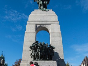 Sentries return to the Tomb of the Unknown Soldier during a ceremony at the National War Memorial in Ottawa Oct. 24, 2014.  (Errol McGihon/QMI Agency)