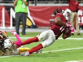 Receiver Larry Fitzgerald (right) hasn’t been getting the targets he used to, but his Cardinals are 5-1, so he’s just fine with it. (AFP)