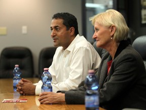 Liberal leader Raj Sherman (l) and candidate Dr. Donna Wilson chats with the Edmonton Sun editorial board at the Sun offices in Edmonton, Alberta on Friday, October 24, 2014. Perry Mah/Edmonton Sun