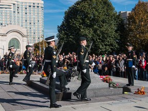 Sentries return to the Tomb of the Unknown Soldier during a ceremony at the National War Memorial in Ottawa October 24, 2014.  Canadian soldier Cpl. Nathan Cirillo was shot and killed at the National War Memorial on October 22,October 24, 2014. Errol McGihon/Ottawa Sun/QMI Agency