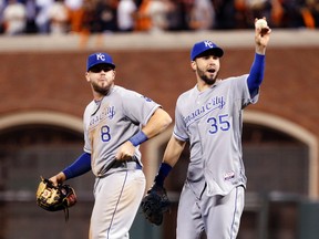 Royals infielders Mike Moustakas (8) and Eric Hosmer (35) celebrate after defeating the Giants during Game 3 of the World Series in San Francisco on Friday, Oct. 24, 2014. (Kelley L Cox/USA TODAY Sports)