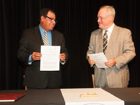 Mary Katherine Keown/For The Sudbury Star
Dr. Izzeldin Abuelaish and Pierre Riopel, College Boreal’s president, sign an agreement with Abuelaish’s The Daughters for Life Foundation.